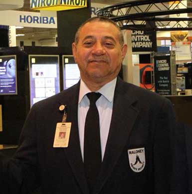 Photo
of a smiling Maloney Security Officer guarding the Moscone exhibitions