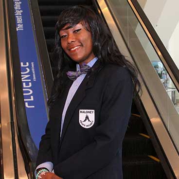 Photo of a smiling Maloney security guard at a Moscone event.